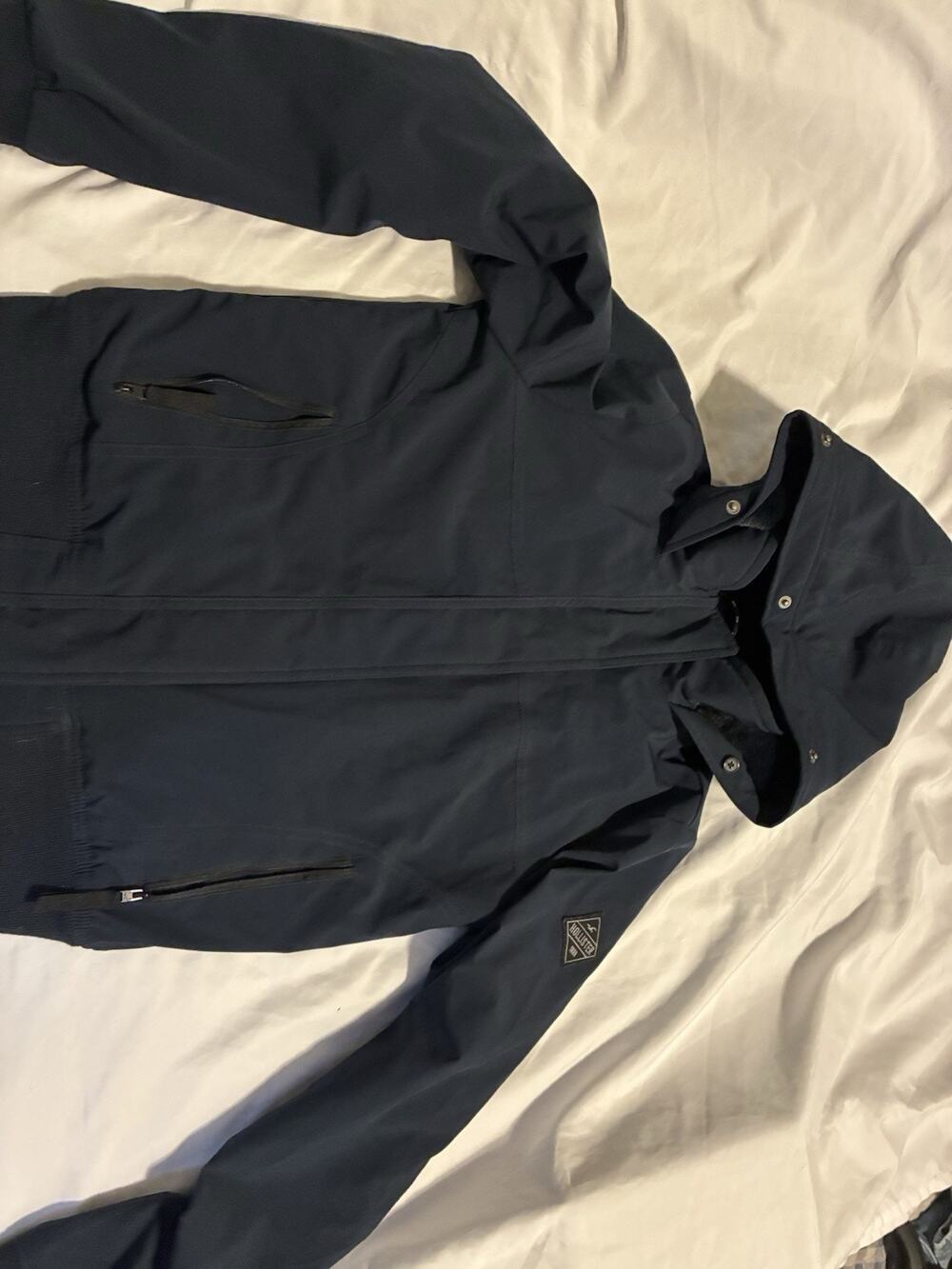 Hollister All Weather Collection Black Puffer Jacket with hood and pockets.